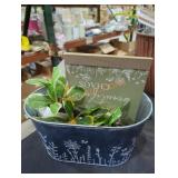 Bucket of fake plants and decorations