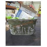 Bucket of fake plants and signs