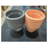 Orange and black flowering pots