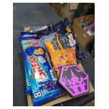 Bucket lot of candy and Halloween decorations