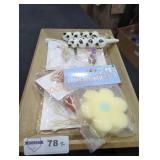 Tray full of sponge and charms