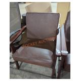 Brown wooden chair with leather cushions Brown wooden chair with leather cushions