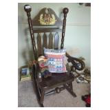 Large Wooden Rocking Chair Flanked by Cannon