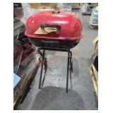 1 red charcoal grill on wheels