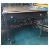 34"W ï¿½ 21"D ï¿½ 30"H Rolling Glass Top Desk