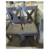 2 gray dining chairs