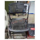 Black plastic fold up chair