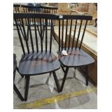2 black dining chairs