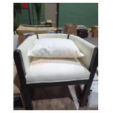 White chair with pillow