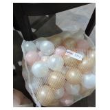 Plastic brown, pearl, and gold balls