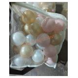 Plastic brown, pearl, and gold balls