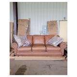 Brown Couch w/ four Pillows