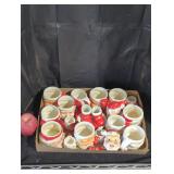 collection of vintage ceramic Christmas mugs.