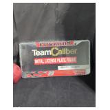 Edwards team caliber metal license plate frame.
