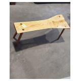Wooden bench with a natural edge 42in L by 17in H.