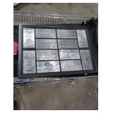 display case containing engraved metal tickets