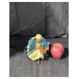 Kneeling king figurine.