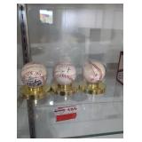 2 signed baseballs and the 1994 world series ball.