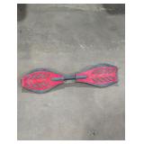Red and black Ripstik caster board.