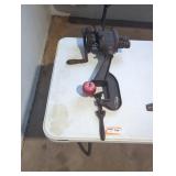 vintage cast iron food mill or apple peeler.