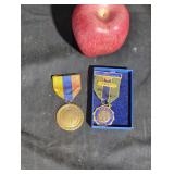 Pair of vintage military medals.