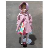 Vintage Doll with Pink Coat and Floral Dress