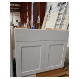 White base cabinet has damage aprox 34"x 26" x24"
