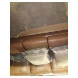 Brown leather couch with pillows