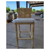 Tan chair with beige cushion