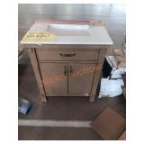 30in light brown vanity with damage white top