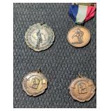 4 vintage metal rewards.