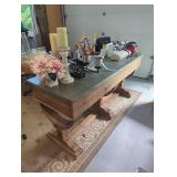 Solid wood table with metal top.