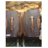 Trio of London fog suitcases.