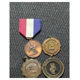 4 vintage metal awards.