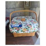 Woven picnic basket with floral fabric on top.