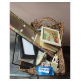 Assorted Artworks and Frames in Woven Basket