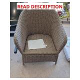 Light brown wicker patio chair