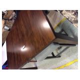 Wooden kitchen dining table with fold beneath leaf