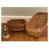 2 longaberger baskets and a Hummel