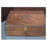 vintage wooden box with brass trim, likely