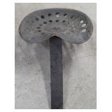 old metal tractor seat