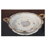 piece of art pottery, specifically a handled