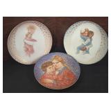 three collectible plates, notably including two