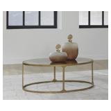 Korjane Antiqued Gold Ovel Coffee Table