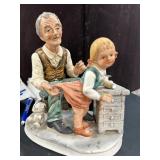 Norleans Figure of Older Man Sewing  Child