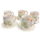 5 teacups with saucers. One cup chipped