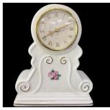 Quartz Porcelain Clock Keeping Time .