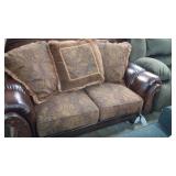 Ashley Woodtrimmed loveseat