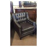 Chocolate tufted club chair