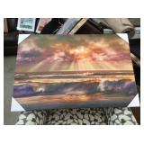 Sun setting over the ocean on canvas